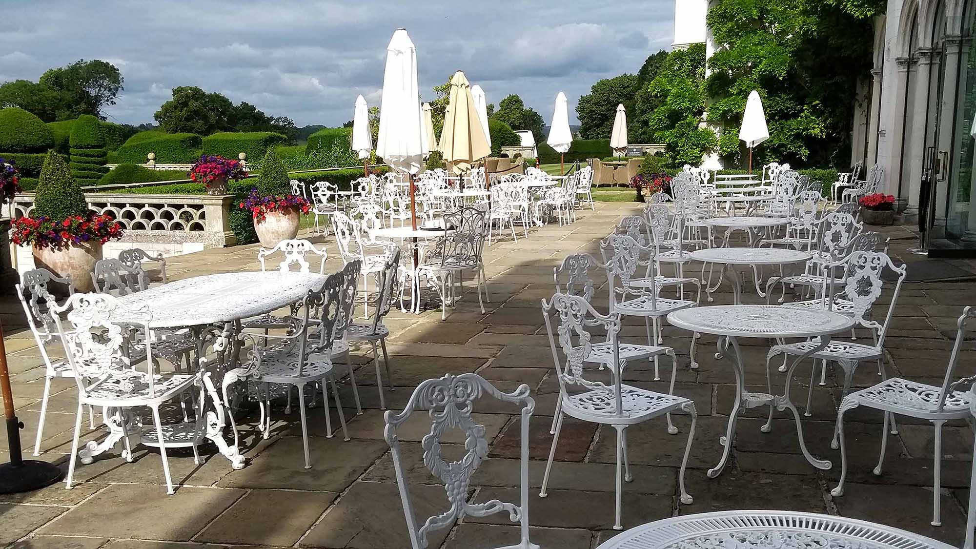 white garden furniture on a large outdoor patio